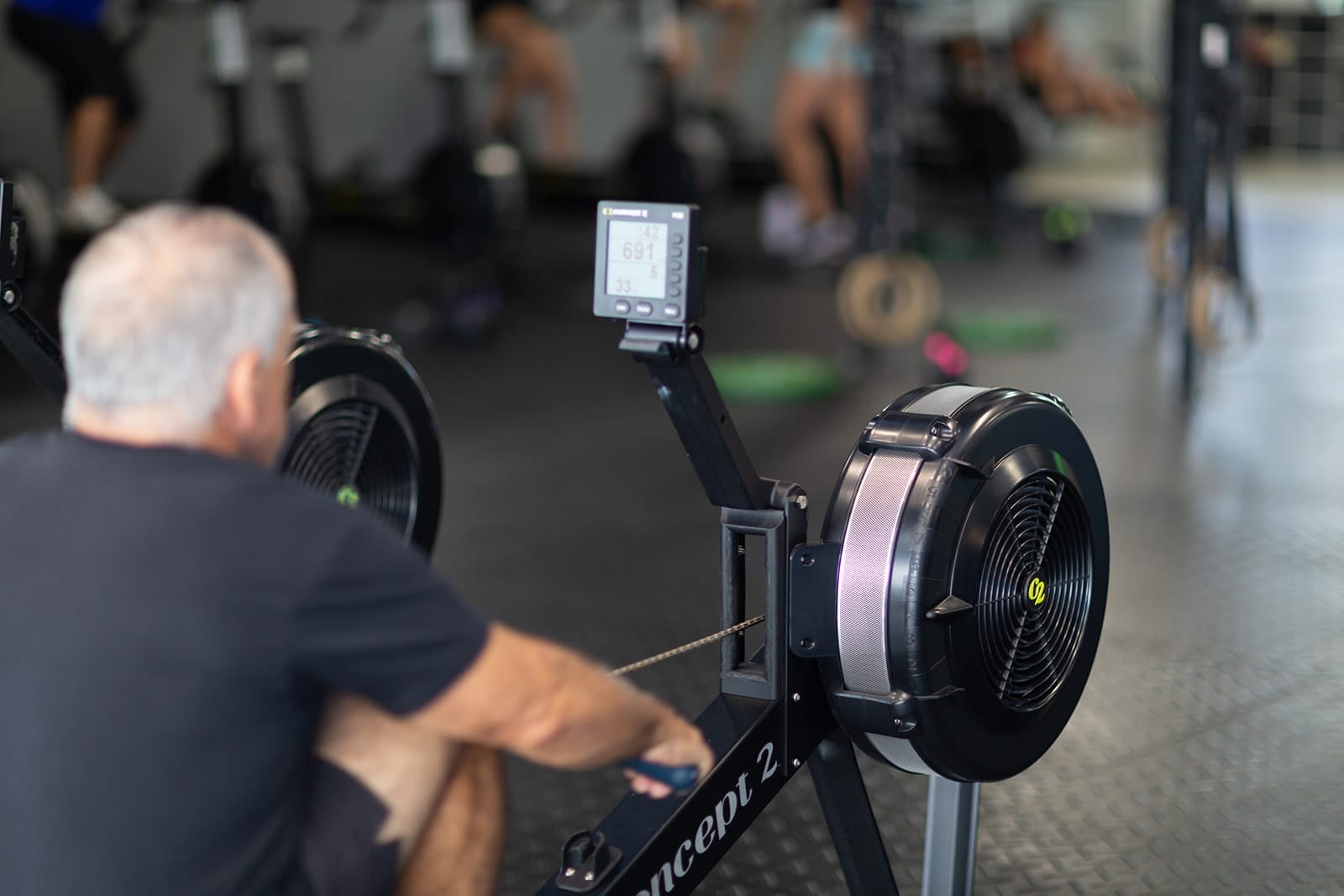 Man on rowing machine