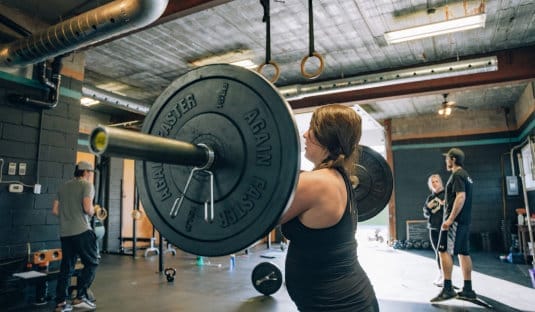 Woman performing strength training in the gym