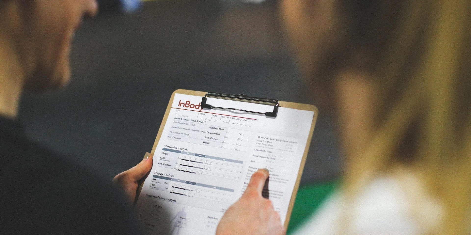 Coach showing report to the client